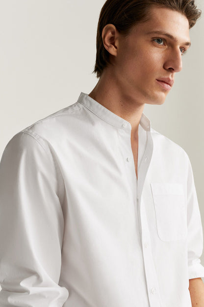 White button-up shirt close-up with spread collar and chest pocket