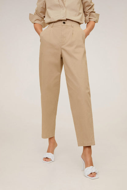 Women's tan high-rise trousers with front button, belt loops, and tapered ankle cuffs