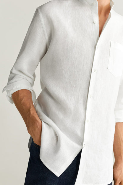 White button-up shirt front close-up, curved hem and button placket detail