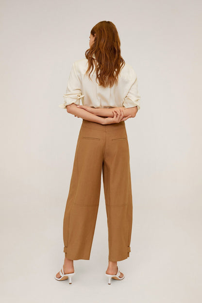 Mango ecru button-up blouse with brown high-waist cropped trousers, back view