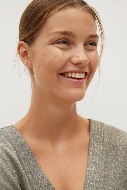 MANGO khaki V-neck short-sleeve top, close-up of neckline