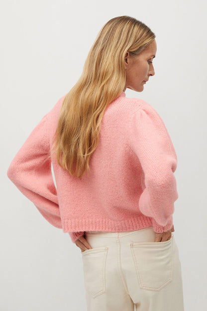 Pastel pink knit sweater with crew neck, long sleeves, back view