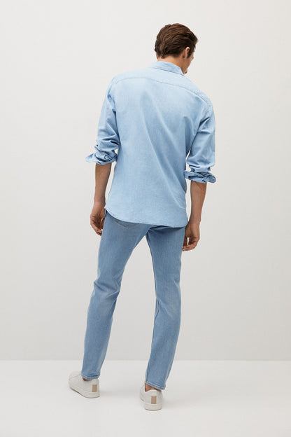 Light blue denim shirt and jeans outfit, back view with straight-leg denim jeans.