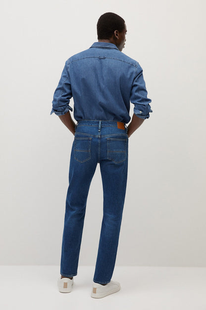 Dark blue denim jeans back view, straight leg with back pockets and belt loops