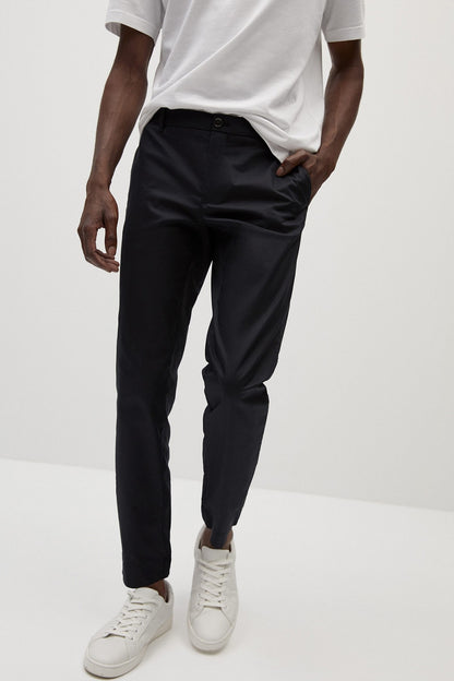 Black tailored trousers with cuffs, button fly, belt loops