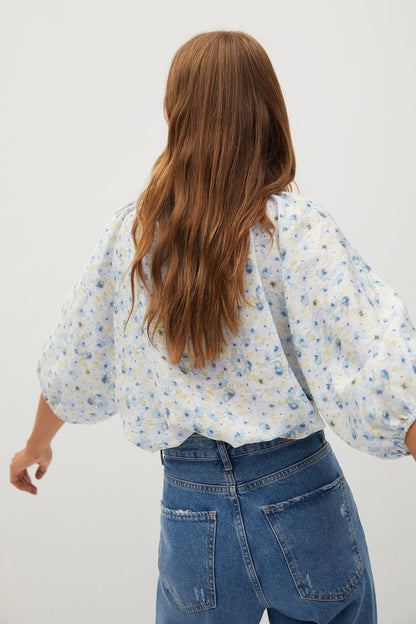 MANGO off-white and light blue floral blouse with puff sleeves and round neckline, back