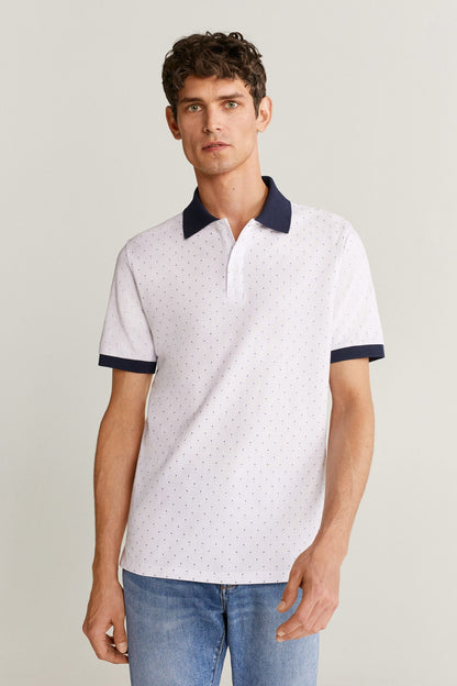 Men's white polo shirt with navy collar, short sleeves, and small dotted pattern