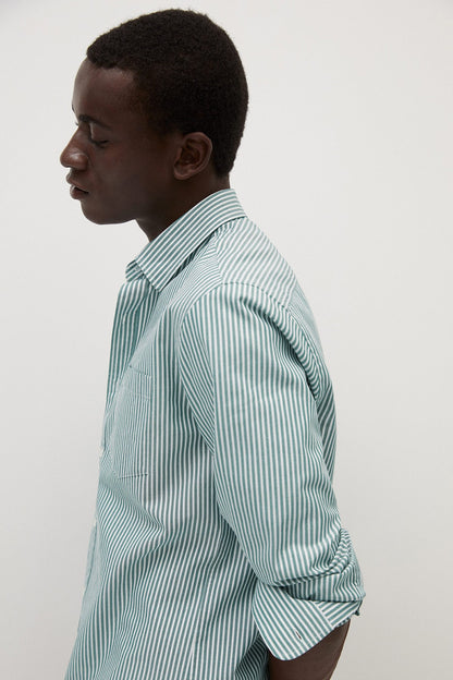 Light blue and white striped button-up shirt, side profile with collar