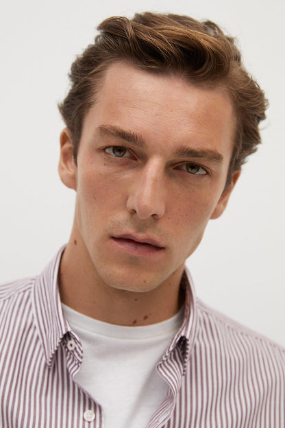 Striped button-up shirt close-up with button-down collar and front placket