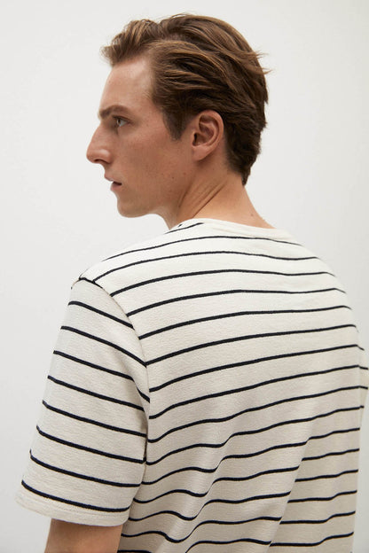 Ecru striped T-shirt back close-up, crew neck, short sleeves with black stripes