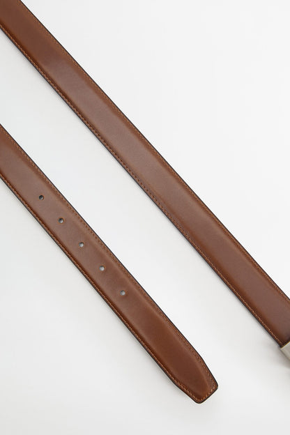 Black leather belt with punched holes and stitched strap edge