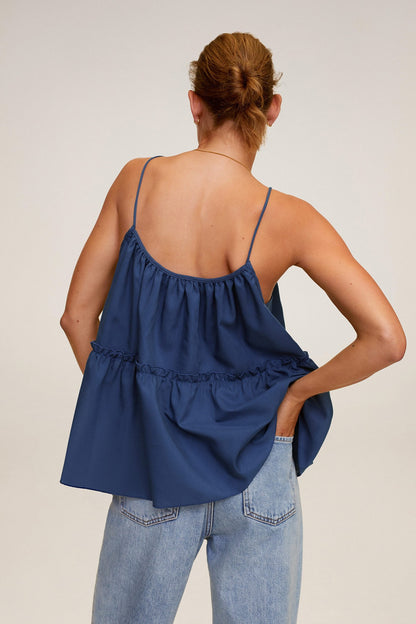 Ink blue sleeveless ruffle camisole with open back, gathered tiers, and thin straps