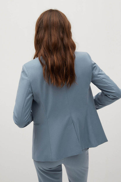 Sky blue women's blazer back view with shoulder seams and front flap pockets