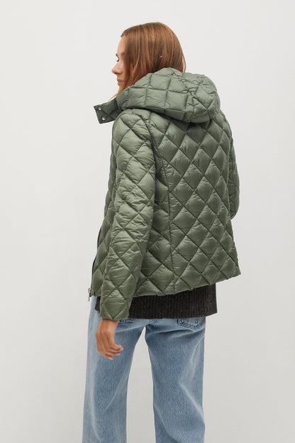Green quilted hooded puffer jacket side view with zipper and hood