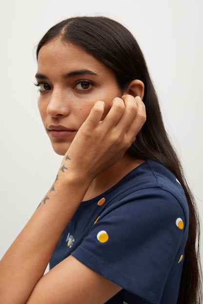 Navy crew-neck T-shirt with yellow dot print, close-up of sleeve detail