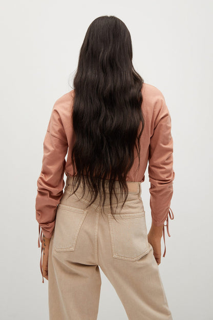 Dusty pink long-sleeve blouse with ruched back shoulder and tie-cuff detail