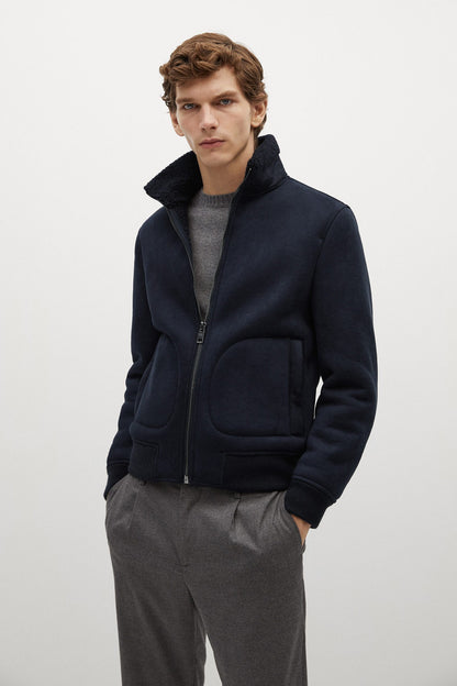 Navy zip-up fleece jacket with stand collar and front pockets