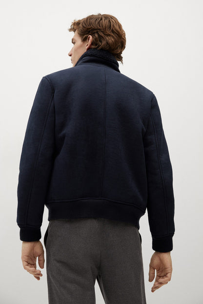 Navy zip-up fleece jacket, back view with ribbed cuffs and hem