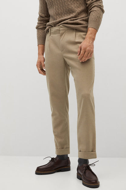 Beige chino-style trousers with front pleats and cuffed hem
