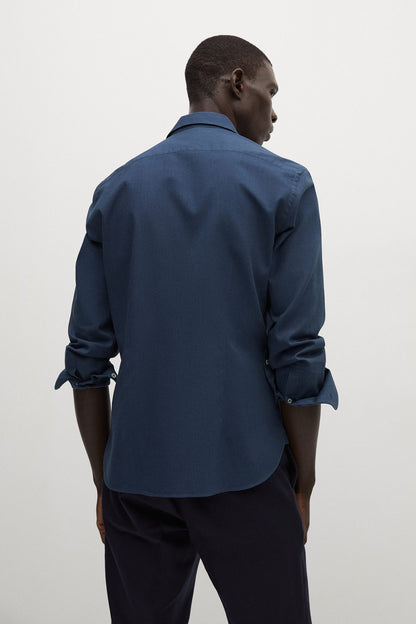 Navy long-sleeve button-up shirt, back view with buttoned adjustable cuffs