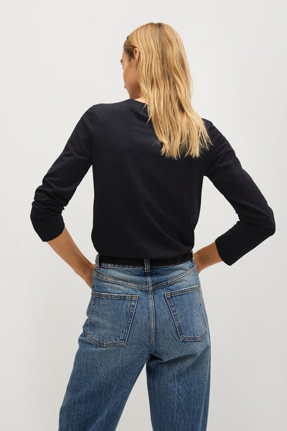 Black long-sleeve crewneck top, back view