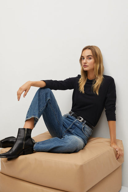 Black long-sleeve crewneck top with fitted sleeves