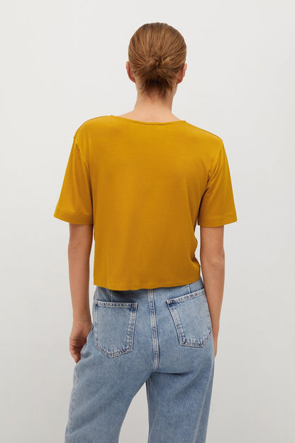 Mustard yellow short-sleeve crew-neck top, back view