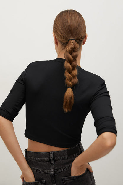 MANGO black long-sleeve cropped top, back view