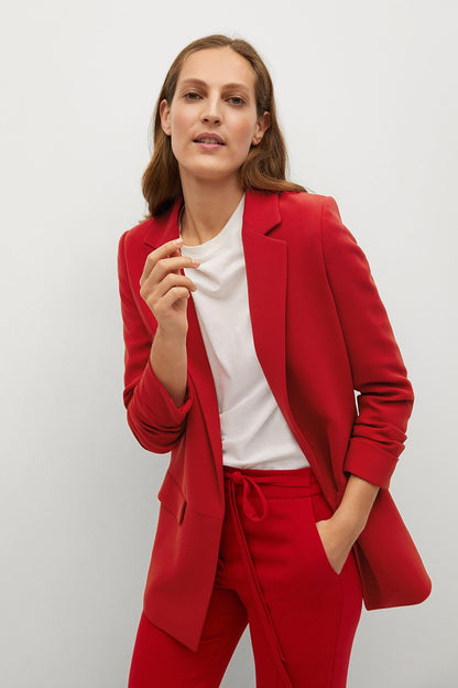 Red blazer and red drawstring trousers with white crewneck top