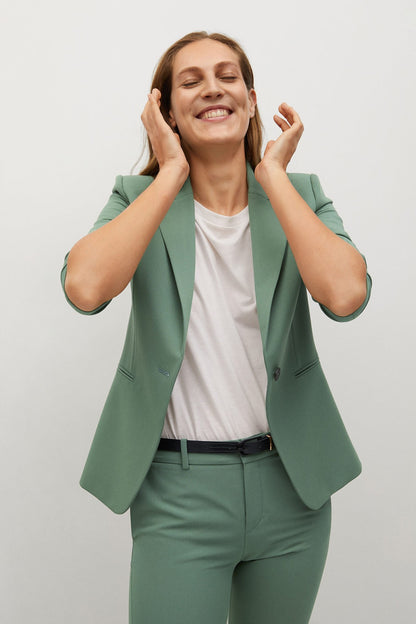 Green blazer with notch lapel over matching slim trousers, front view