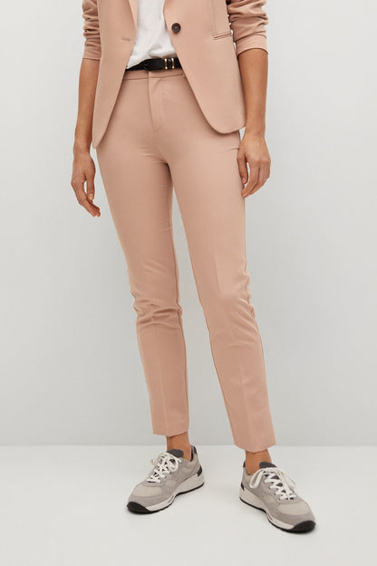 Peach suit trousers with cuffed hem, belt loops, and front button closure