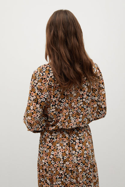 Dark floral long-sleeve dress, gathered skirt and V-neck tie at back view