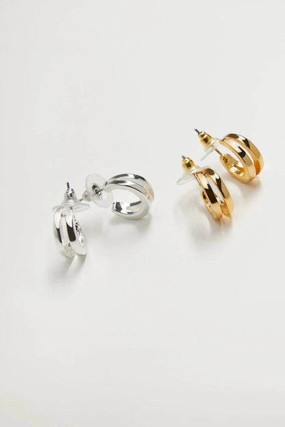 Silver and gold hoop earrings with circular rings and gold dangle detailing
