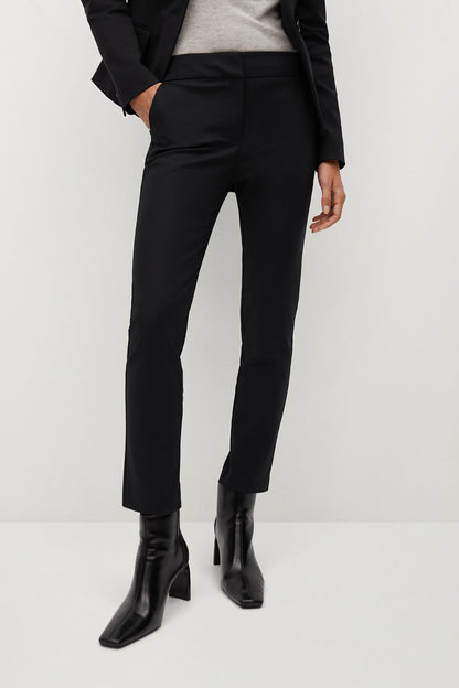 Black tailored trousers with straight slim legs and front crease