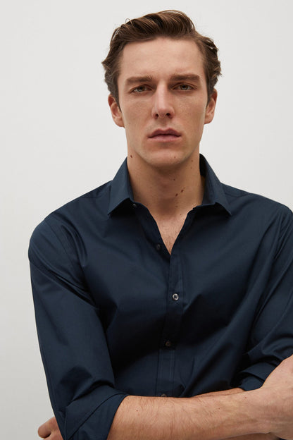 MANGO navy button-up shirt close-up with collar and dark buttons