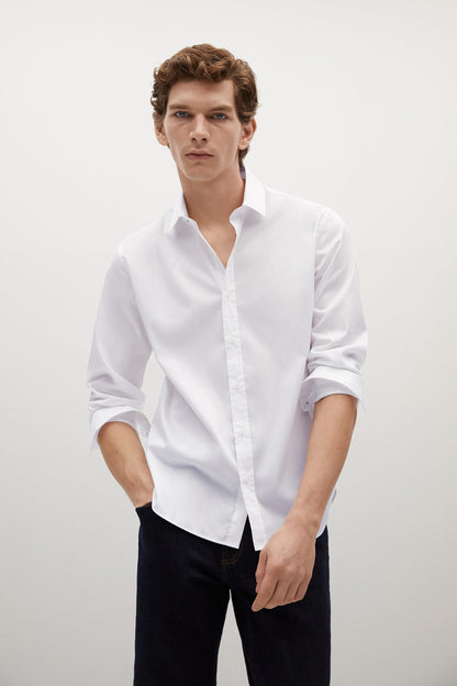 White button-up shirt with long sleeves and open collar