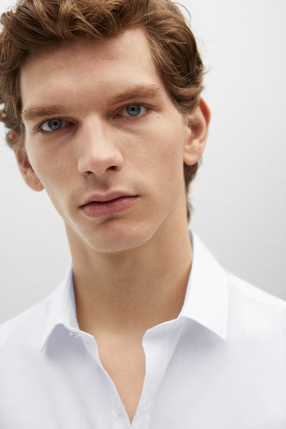 White button-up shirt collar detail with visible stitching and buttons