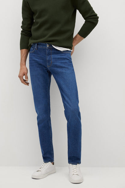 Dark blue denim jeans with belt loops, straight legs, and rolled hems
