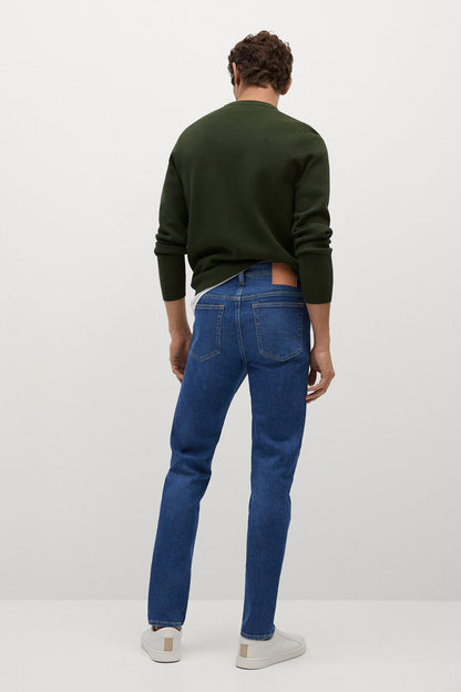 Dark blue denim jeans back view with belt loops and straight leg fit