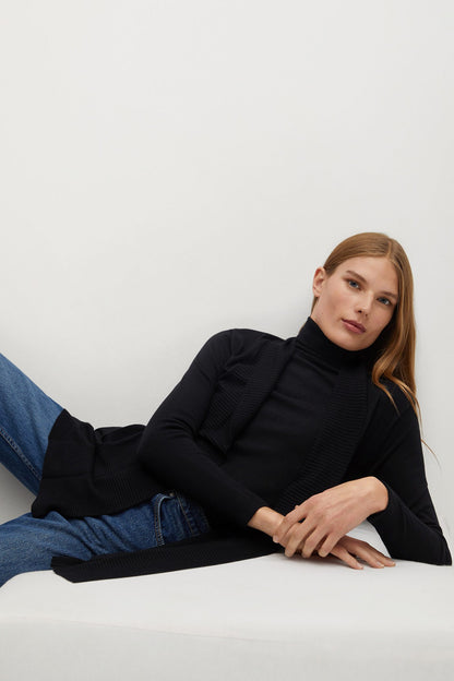 Black long cardigan with textured knit, styled with blue jeans