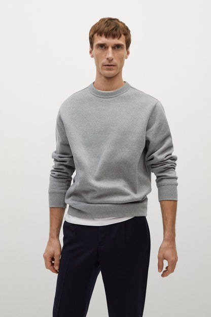 Men's heather grey crewneck sweatshirt with long sleeves and ribbed hem