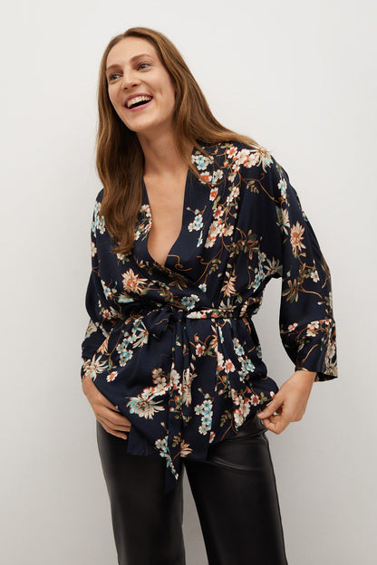Floral wrap blouse with V-neck, long sleeves, and tie waist belt; dark base color