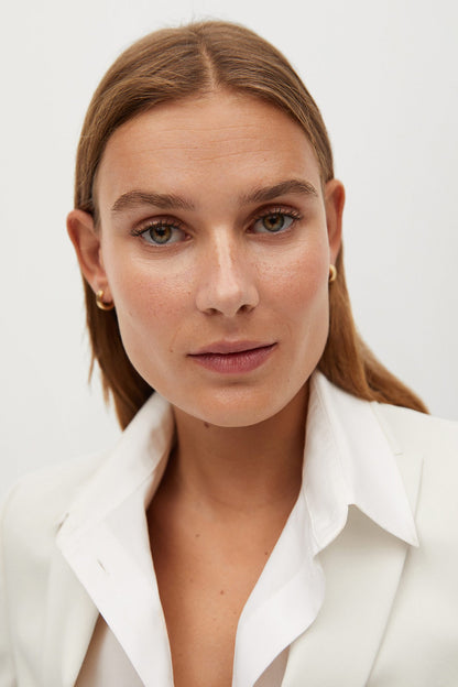 MANGO white blazer collar and lapels close-up, button-front detail