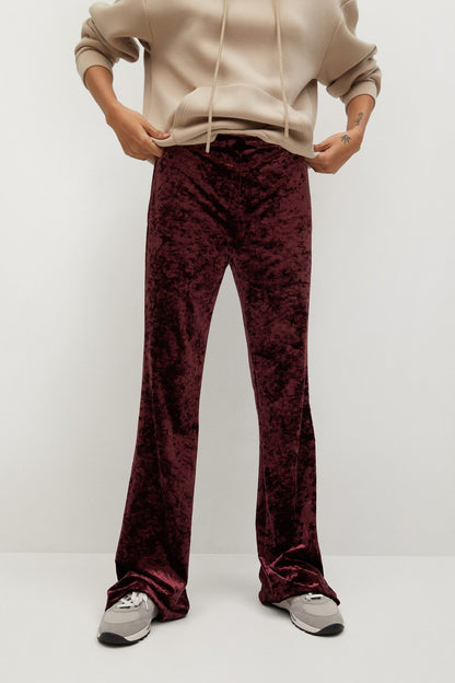 Maroon velvet flared pants, front view with wide leg openings