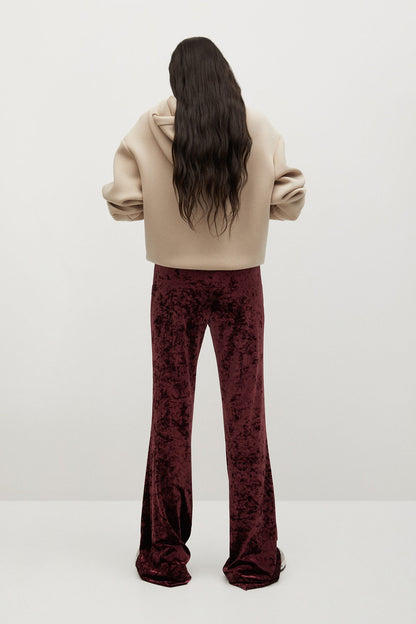 Maroon velvet flared pants, back view with wide leg silhouette