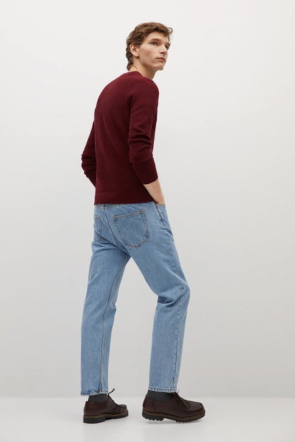 Men's red knit crewneck sweater, side view with ribbed cuffs