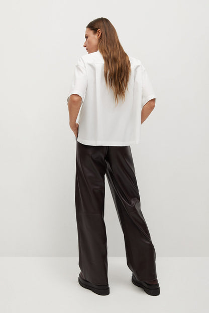 White short-sleeve button-up shirt with pointed collar and structured shoulders