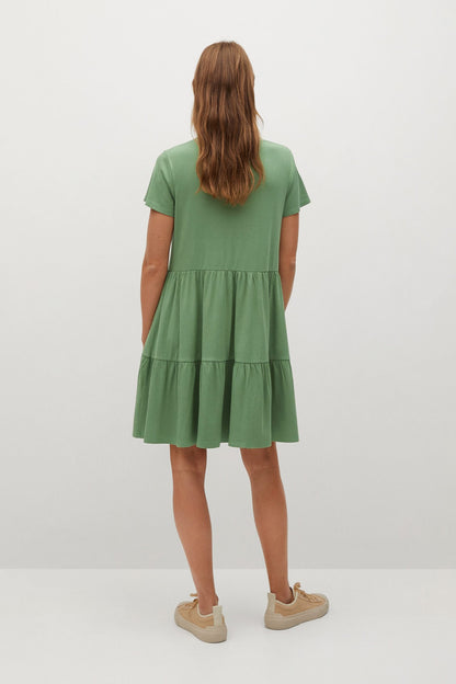 MANGO green tiered mini dress, back view with short sleeves and crew neckline