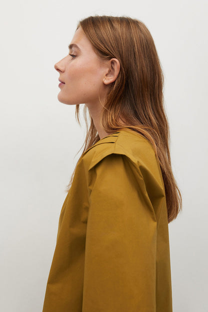 Ochre short-sleeve top with collar, paired with matching cropped pants