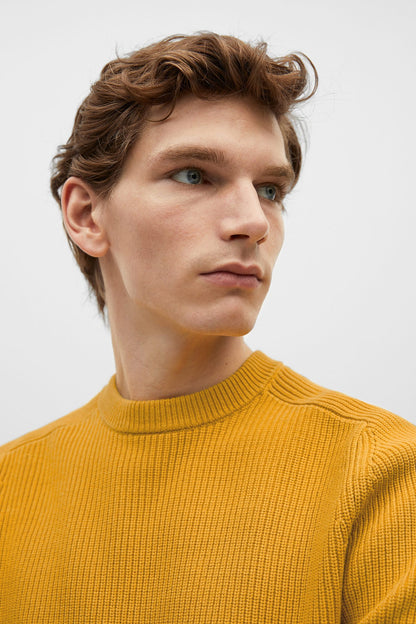 Yellow ribbed knit crewneck sweater close-up of collar